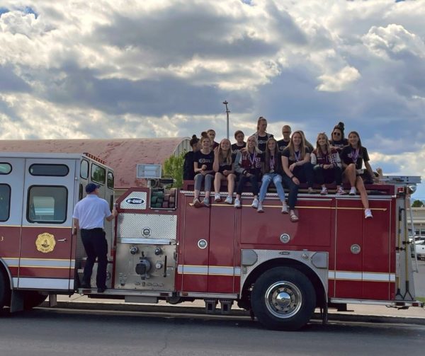 HHS Girls Track Team on Fire Truck for Celebratory 2022 State Champs Drive