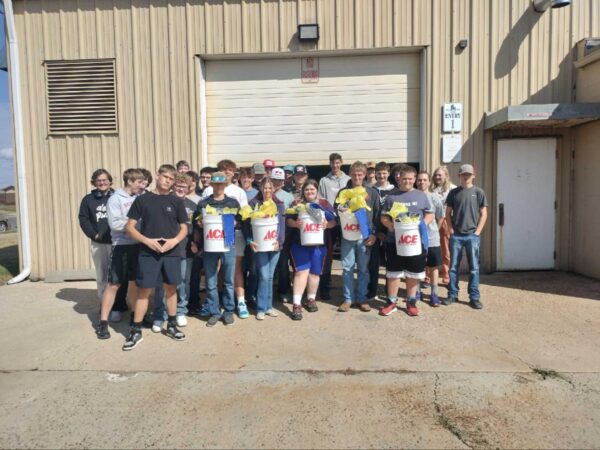 Helena High School Welding Teacher Cindy Galbavy and her class hold buckets of tools donated by Rock Hand Ace Hardware in Helena.